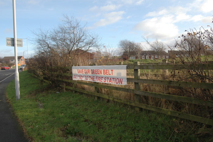 Protest sign at proposed Green Belt site of new fire station on Saughall Massie Road