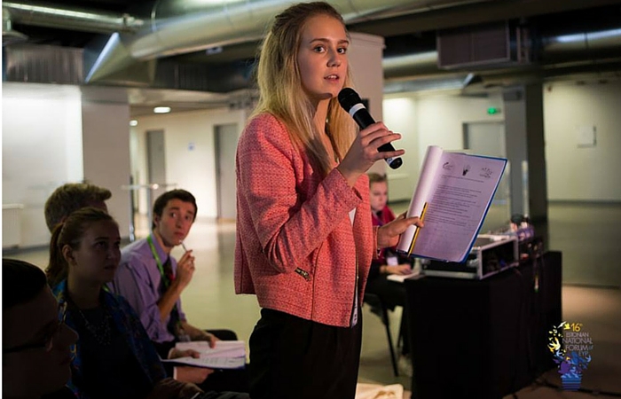 Lucy takes the microphone at EYP in Estonia