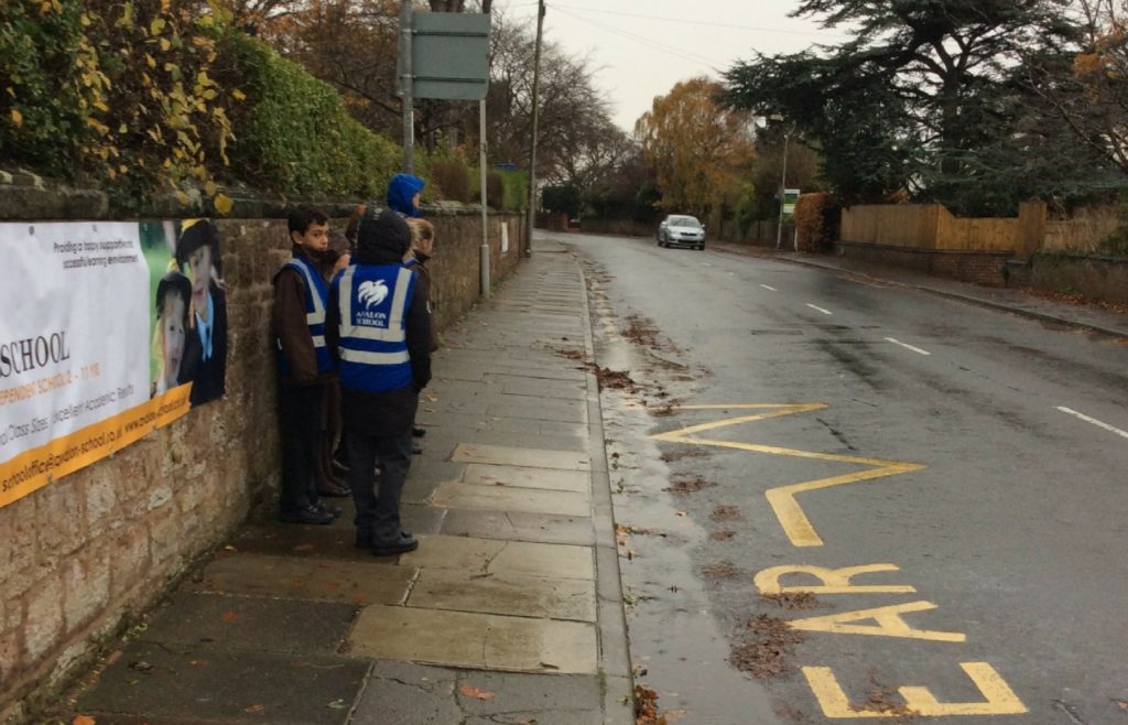 Avalon School children watch out for speeding motorists on the road outside