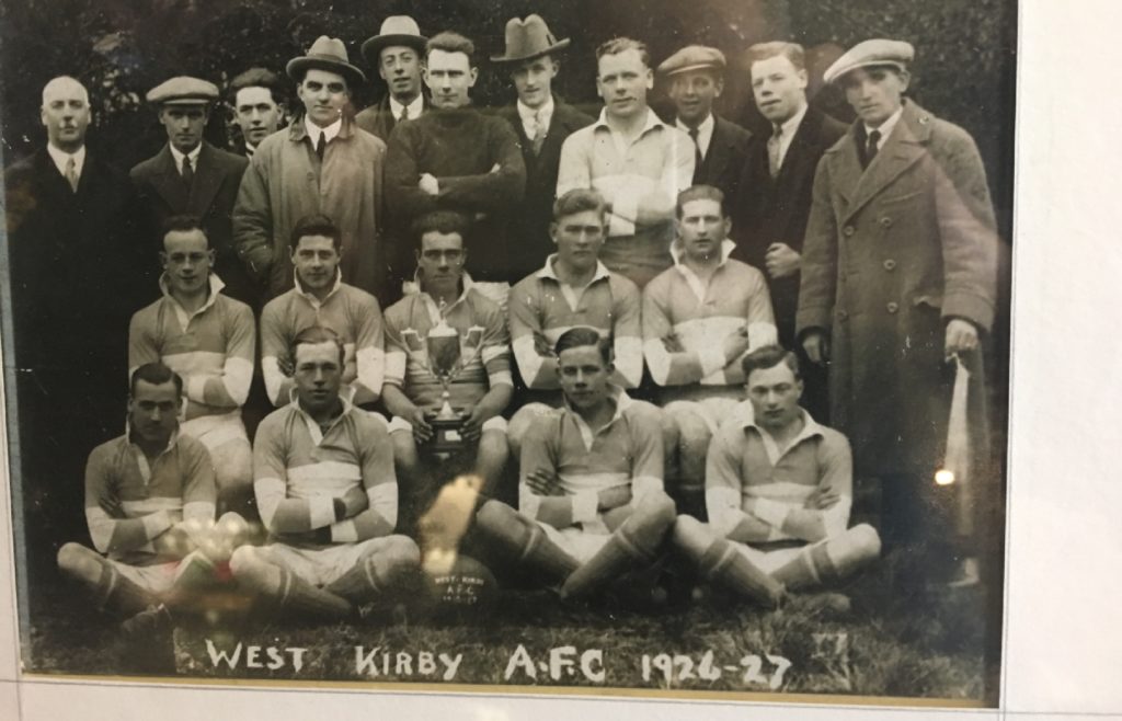 Dixie Dean (centre, with cup) with his cup-winning West Kirby FC colleagues in 1927