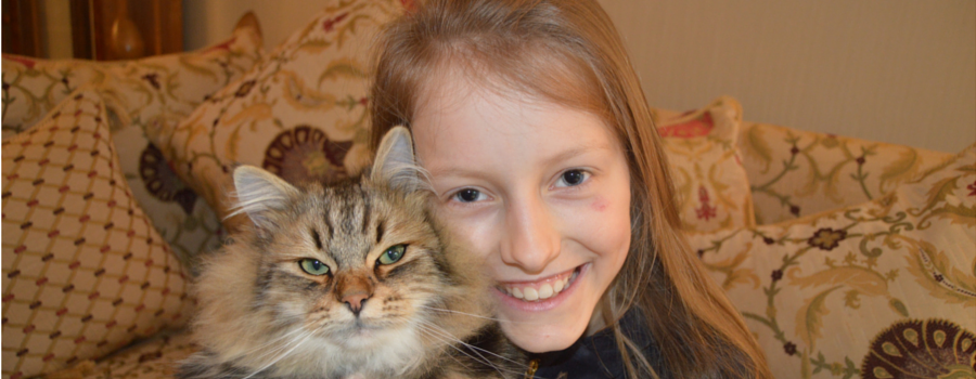 Basja the cat with owner Marsha, aged 9