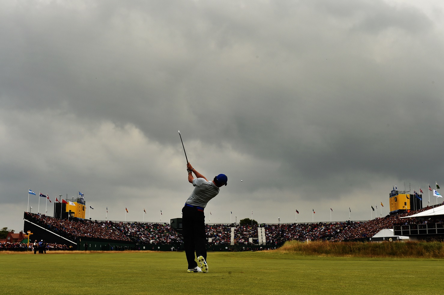 HOYLAKE, ENGLAND - JULY 19:  Rory McIlroy of Northern Ireland plays his second shot on the 18th hole during the third round of The 143rd Open Championship at Royal Liverpool on July 19, 2014 in Hoylake, England.  (Photo by David Cannon/R&A/R&A via Getty Images)